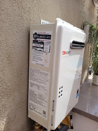 Outdoor Tankless Water Heater Installation On Stucco Style Wall